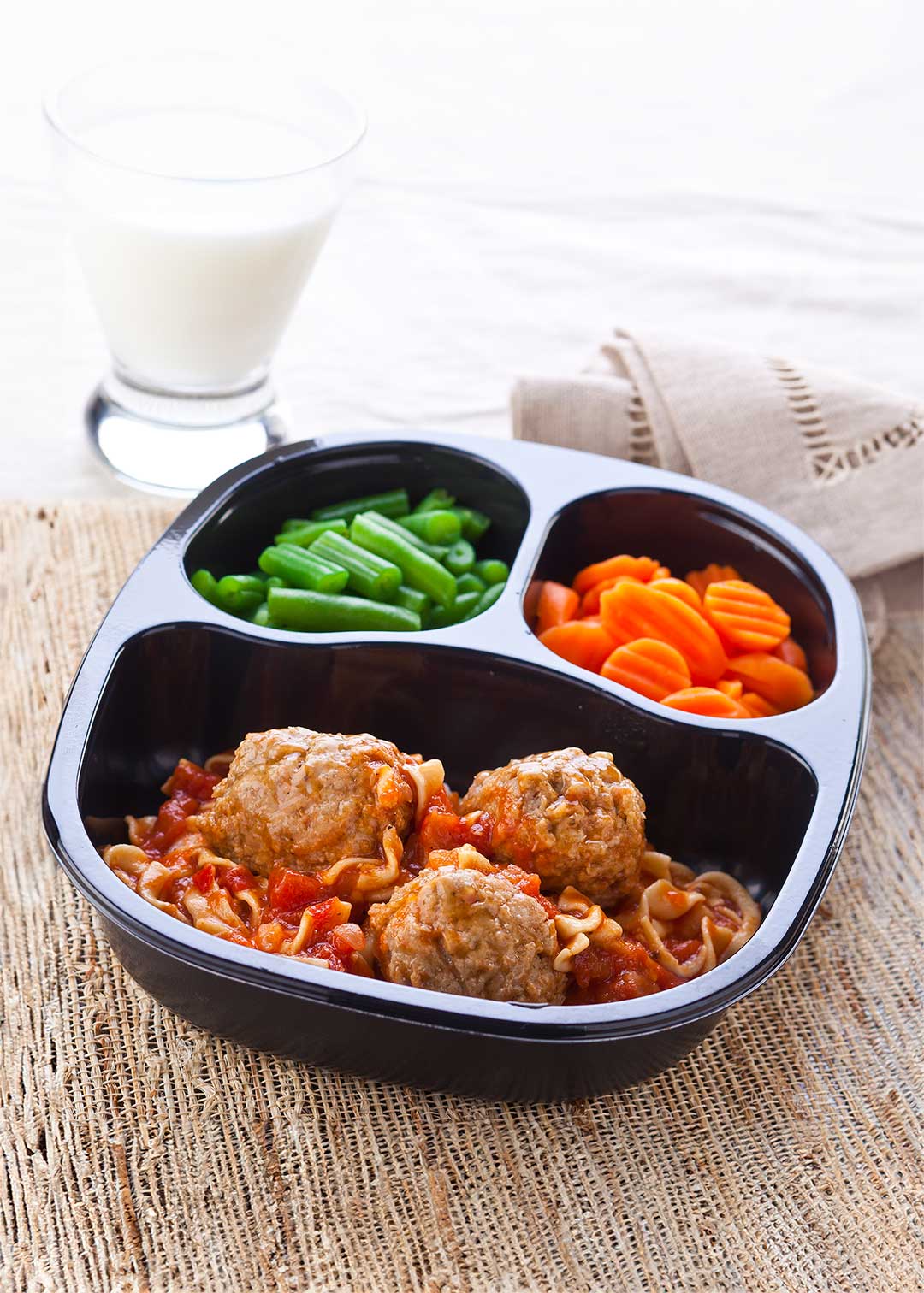 Meatballs over Egg Noodles and Pizzaiola Sauce with Carrots & Green Beans