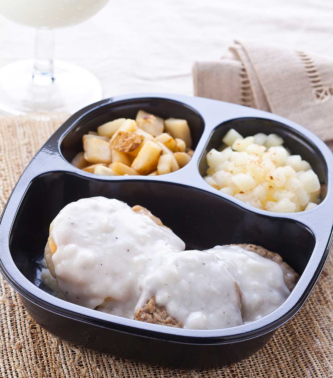 Sausage Patties and Biscuit with Country Gravy served with Cinnamon Apples & Hash Browns